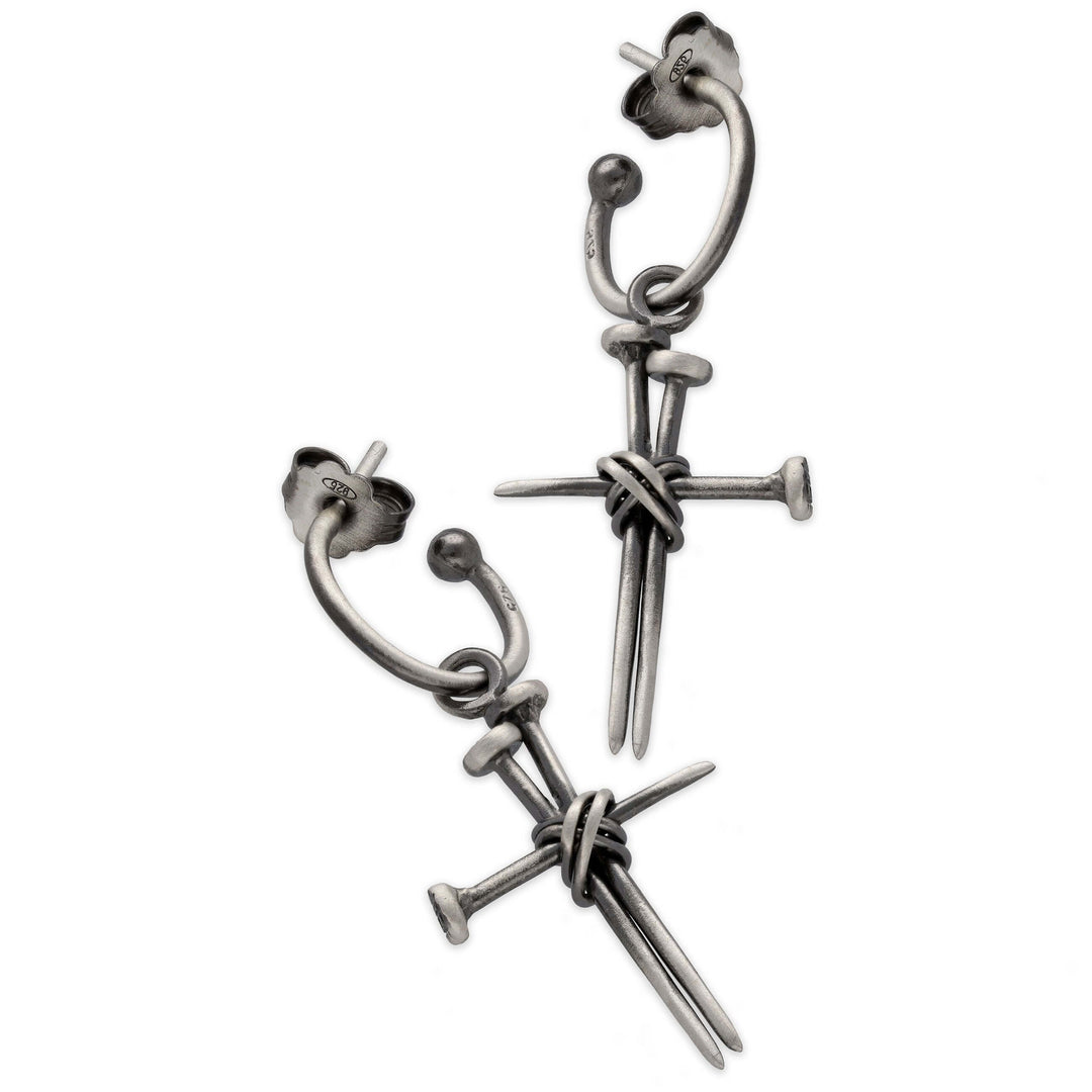 Men's earring with cross made of spikes